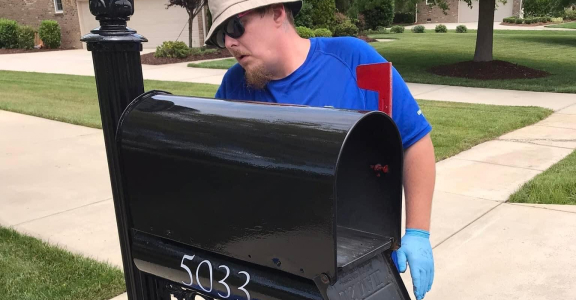 Man Painting Mailbox